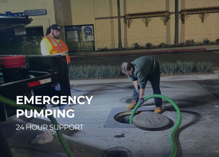 Technician using a vacuum pump for commercial grease trap cleaning in san diego