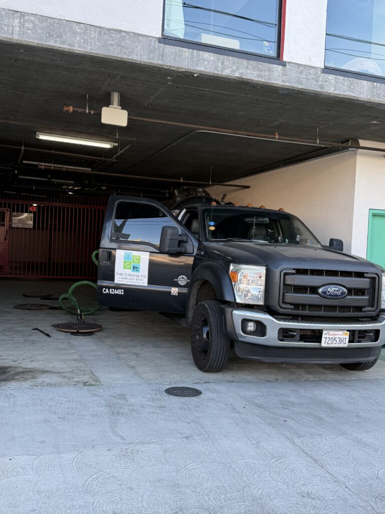 Chula Vista Grease Company pumping truck removing grease from commercial kitchen interceptor